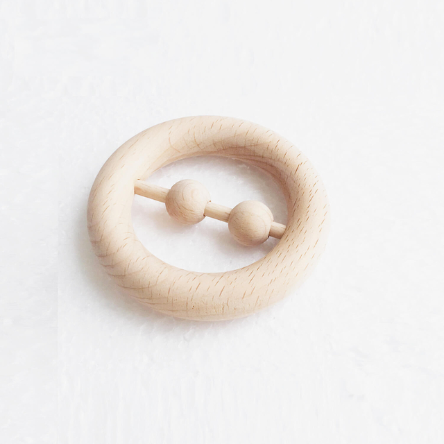 Wood rattle with two beads